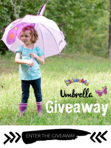 girl with kidorable umbrella and boots